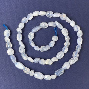 Намистини Агат блакитний галтівка 8х6мм+- на нитці L-40см+- 72620 фото