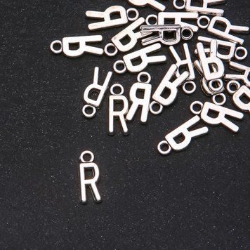 Фурнітура підвіска Буква "R" 17х7мм фасування 20грам (+ - 25шт.) 40630 фото